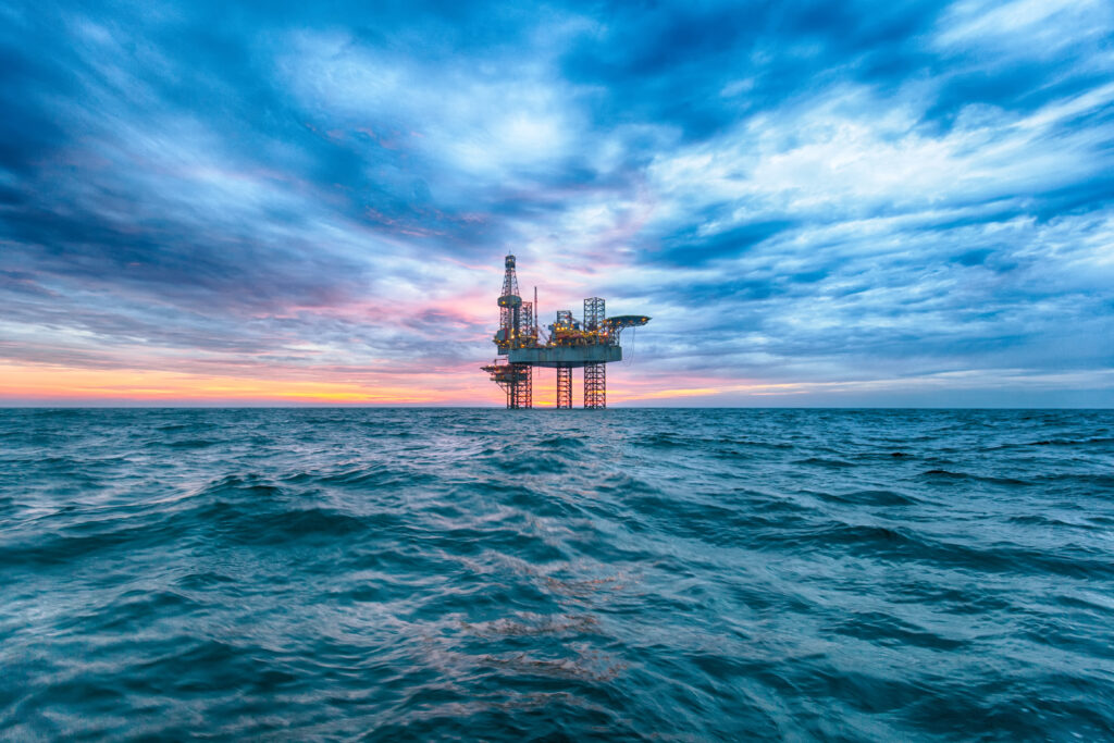 Offshore rig at sunset time in the sea